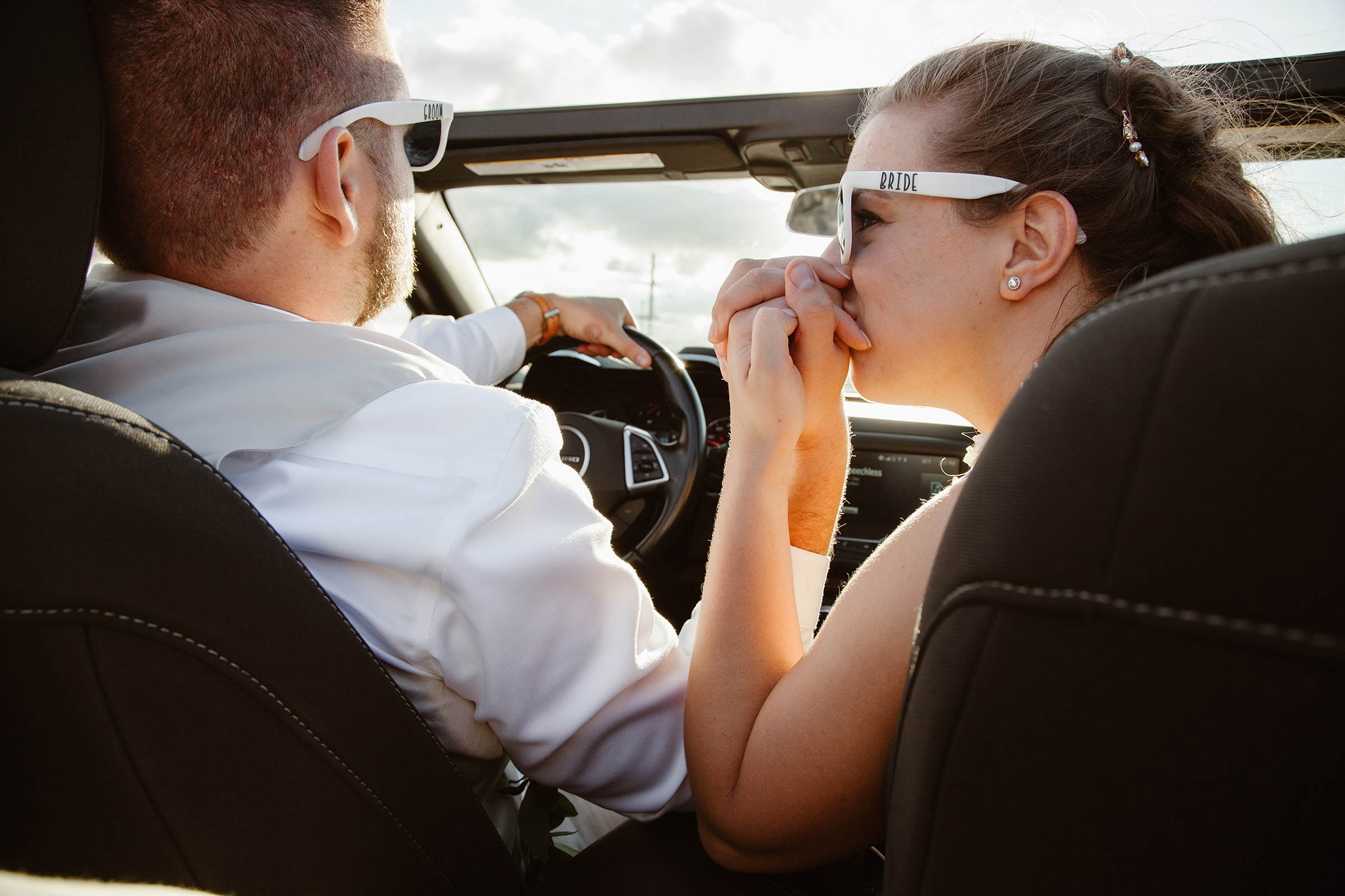 Brittany kissing Andy's Hand in a Car