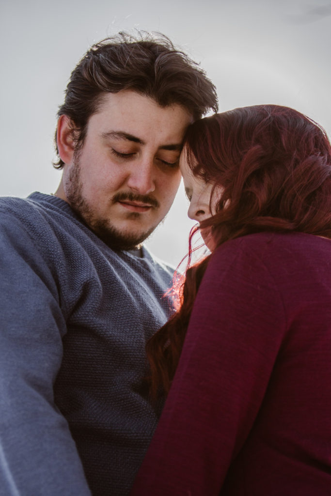 Couple taking a moment with their foreheads together