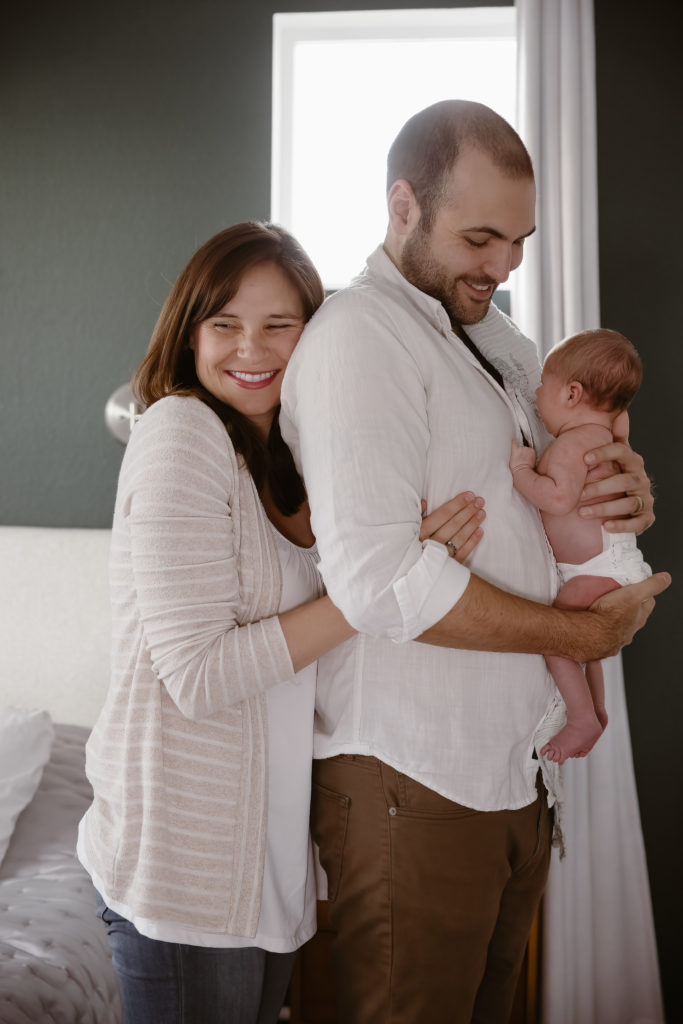 Couple holding newborn baby