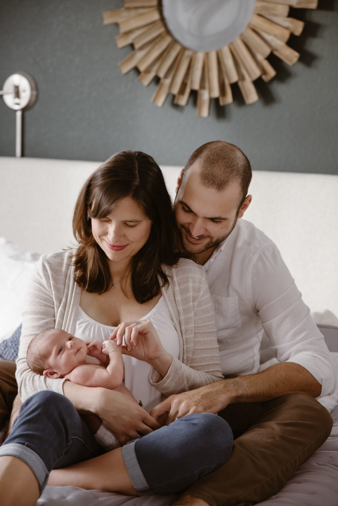 Couple holding newborn baby