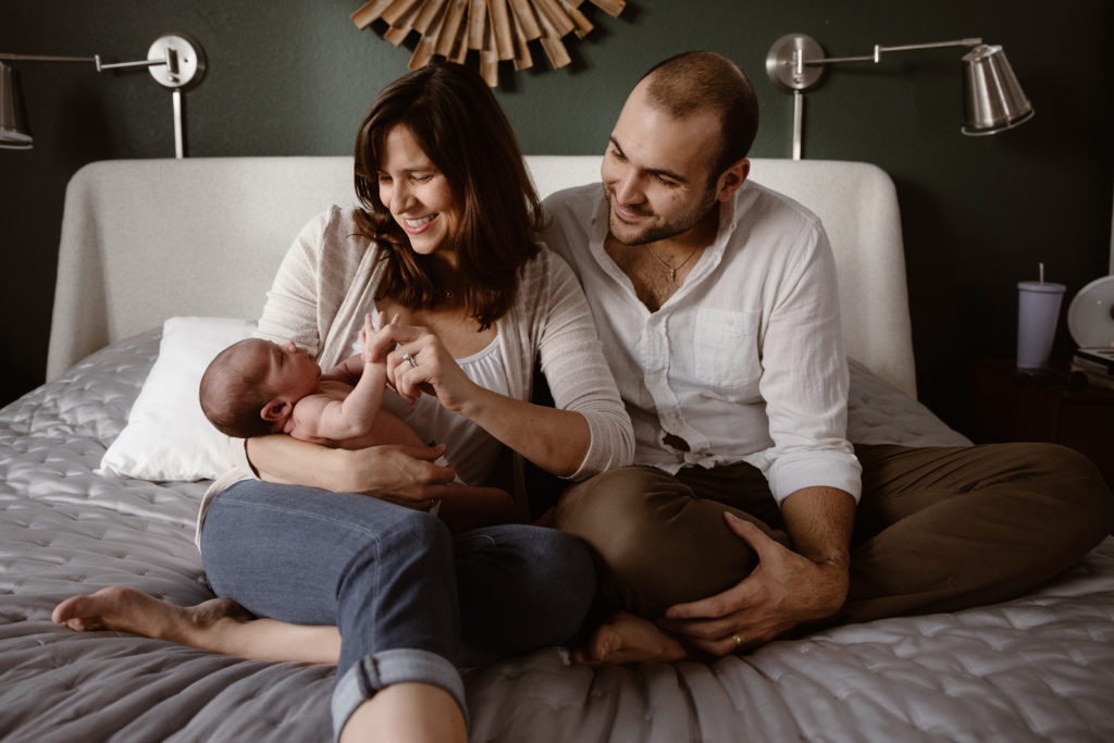 Couple holding newborn baby