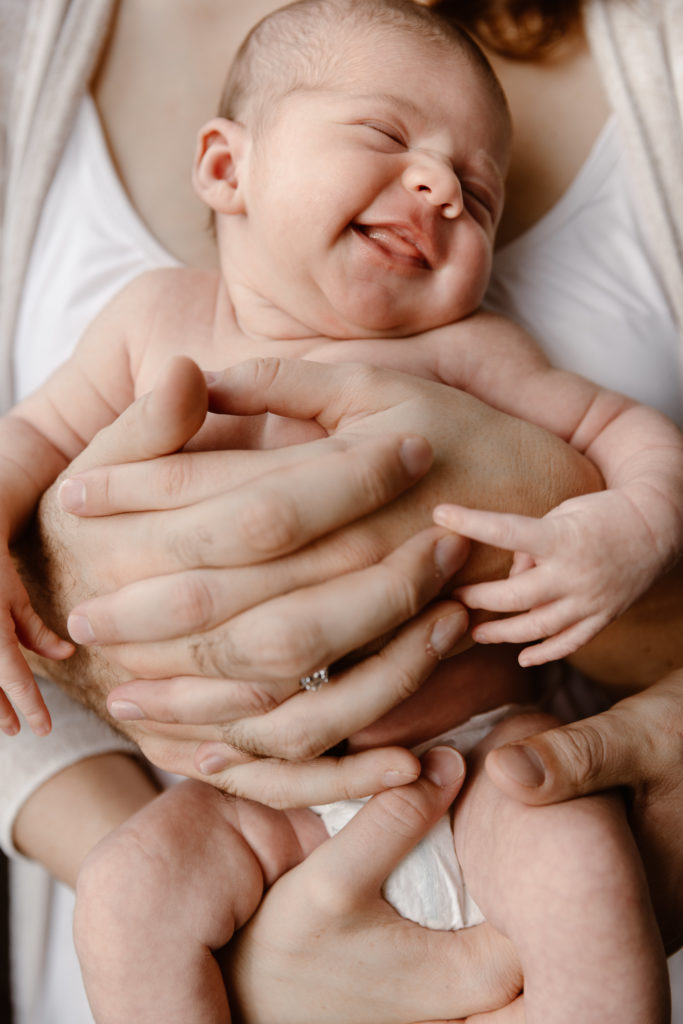 Couple holding newborn baby