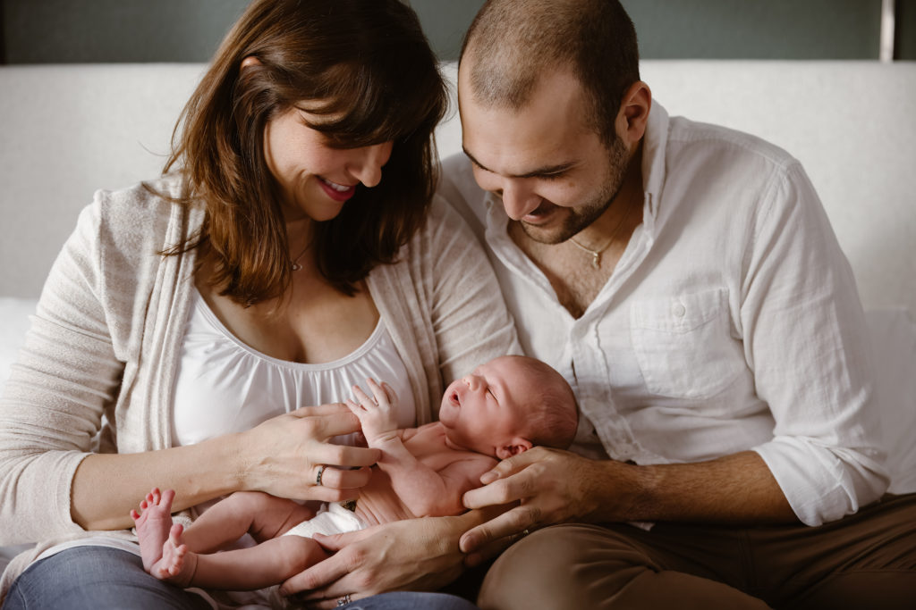 Couple holding newborn baby