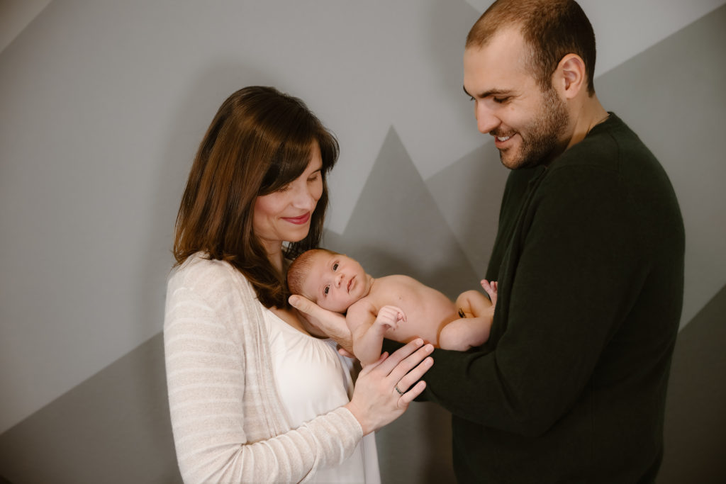 Couple holding newborn baby