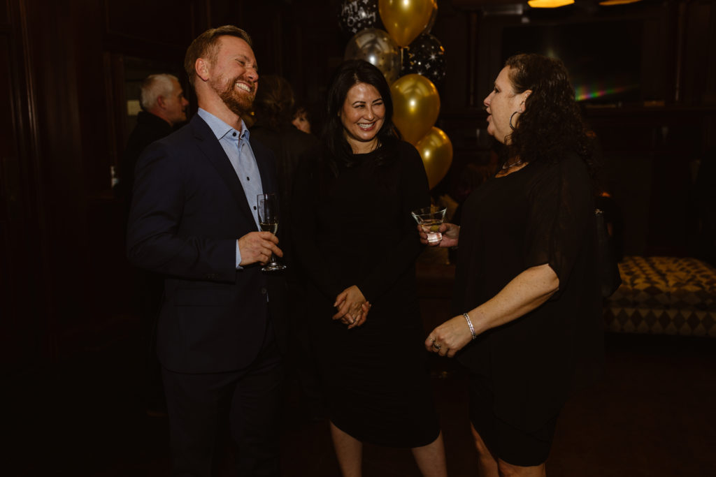 Candid of people smiling at a 40th birthday party