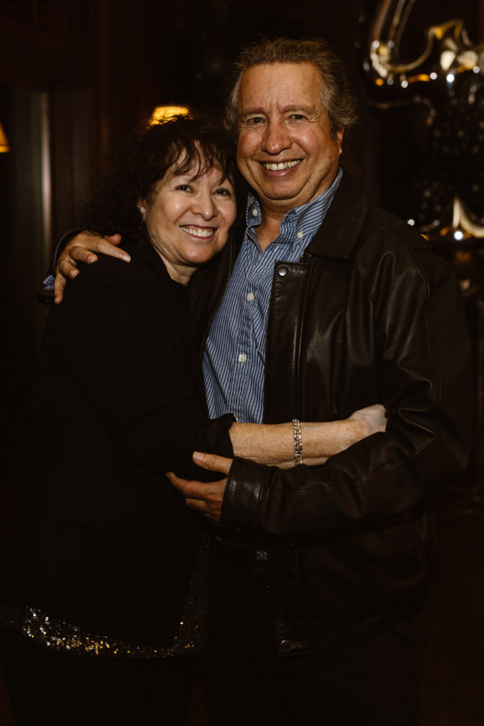 Portrait of a couple at a 40th birthday party.