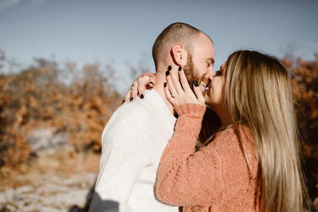 Couple smiling, right about to kiss