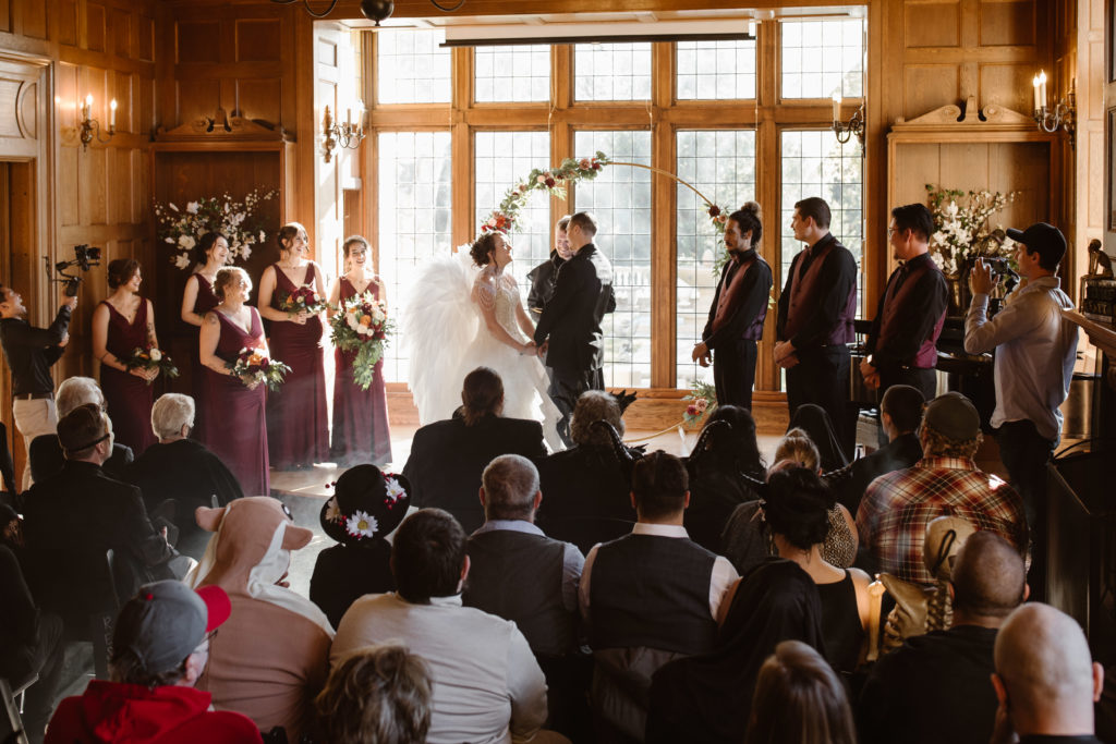 Bride and groom getting married inside.