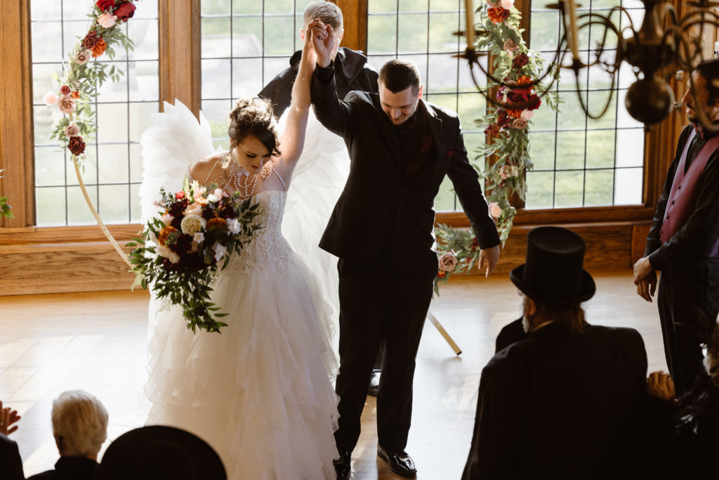 Bride and groom celebrating after being married inside
