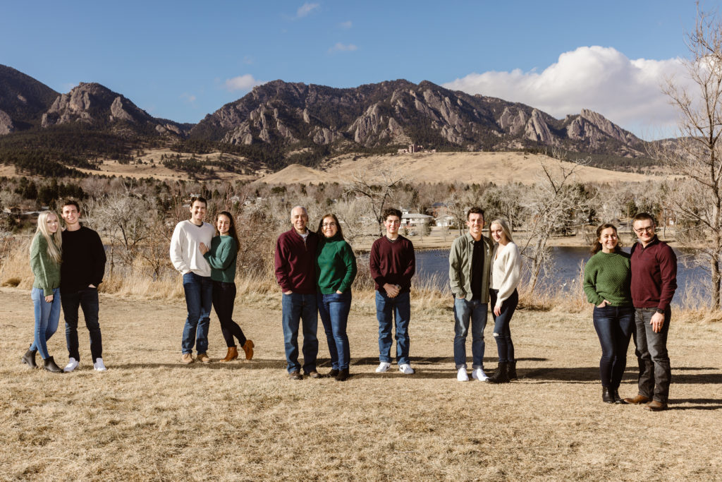 Large family photo with the Flatirons in the background