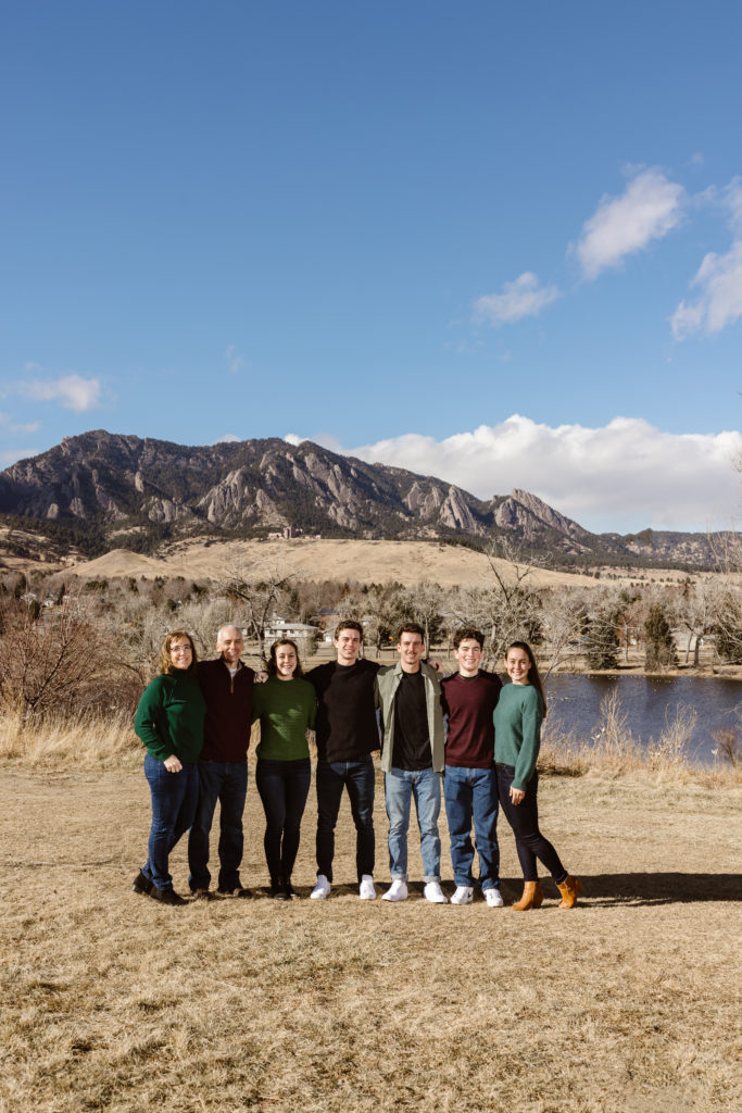 Large family photo with the Flatirons in the background