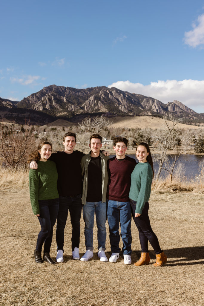 Large family photo with the Flatirons in the background