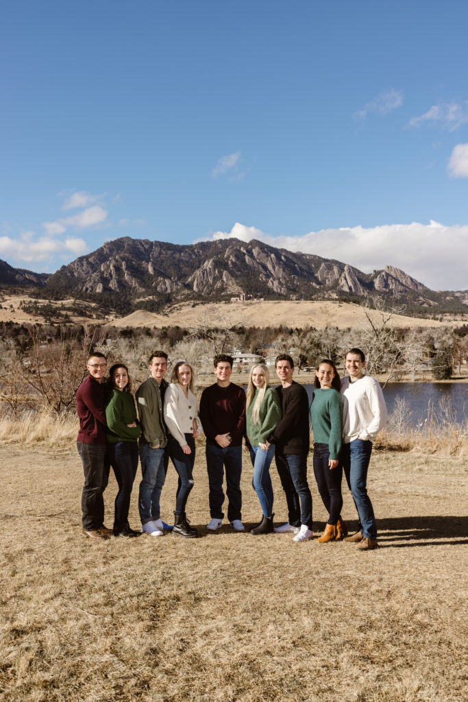 Large family photo with the Flatirons in the background
