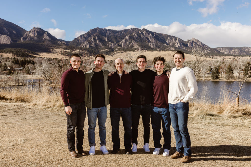 Dad, sons and son in-law with the Flatirons in the background