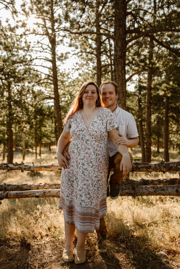 Couple with arms around each other looking at the camera