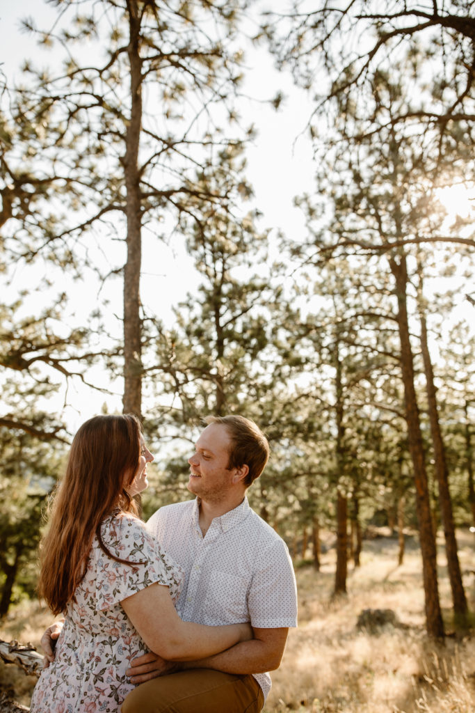 Couple with arms around each other