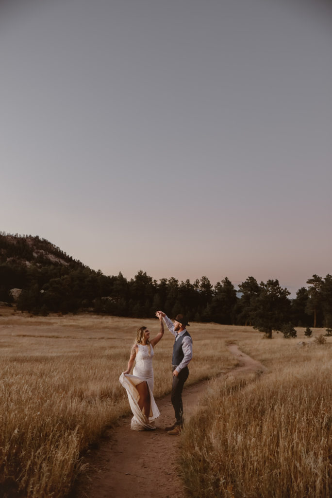 Groom twirling his bride