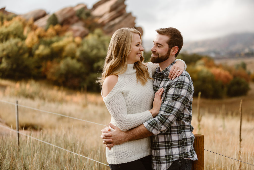 Couple with arms around each other