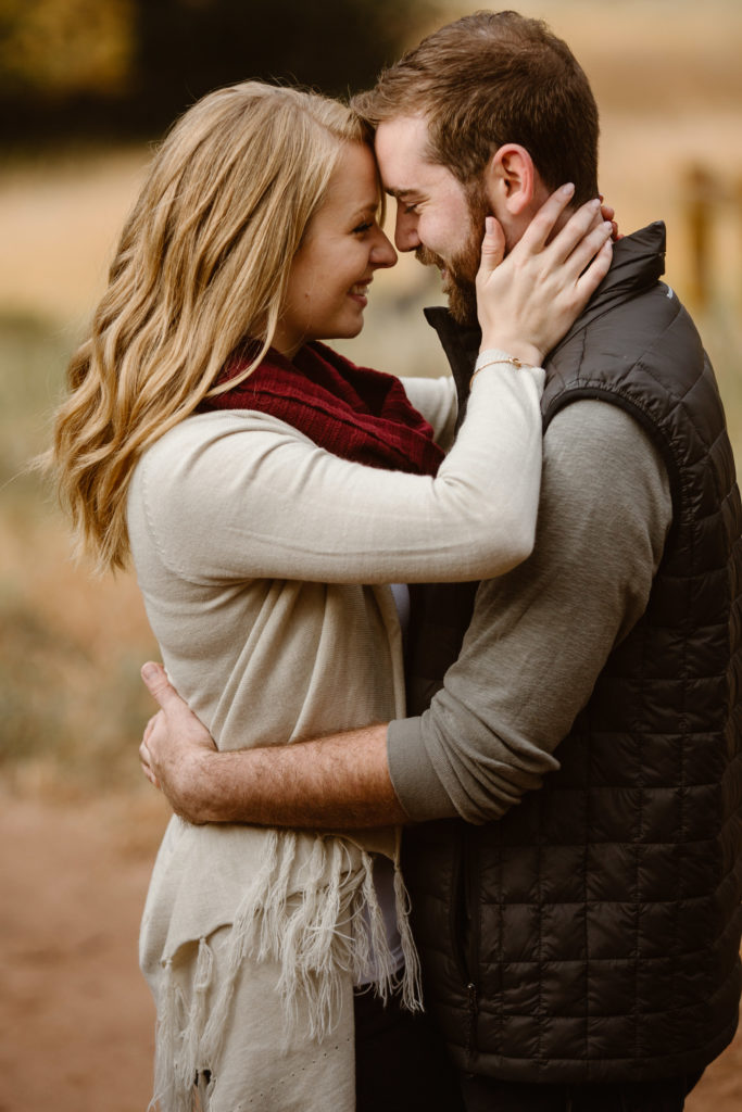 Couple with their foreheads together smiling