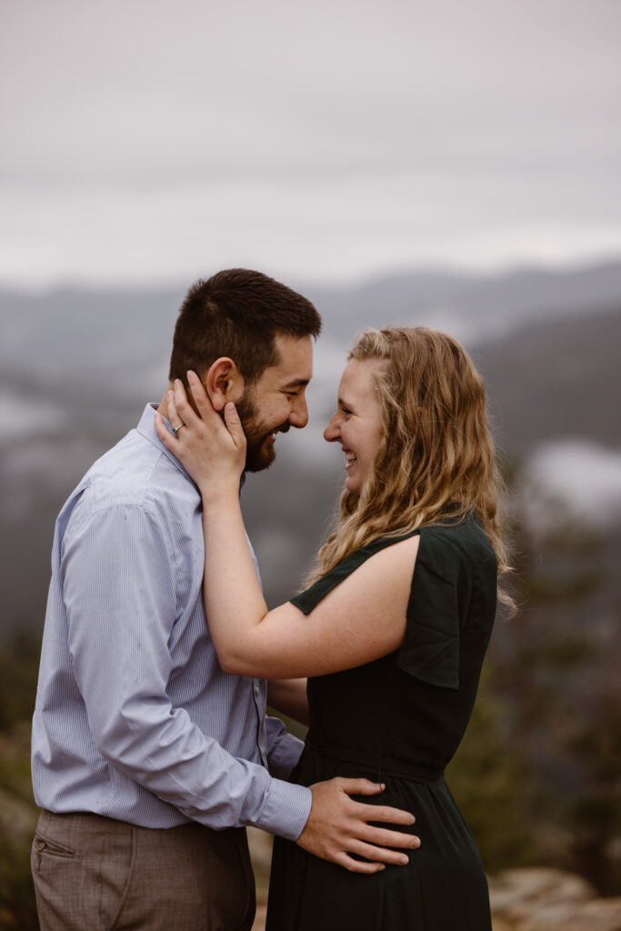 Engaged couple looking into each other's eyes smiling