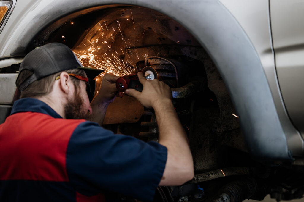 Mechanic working on a car's wheel