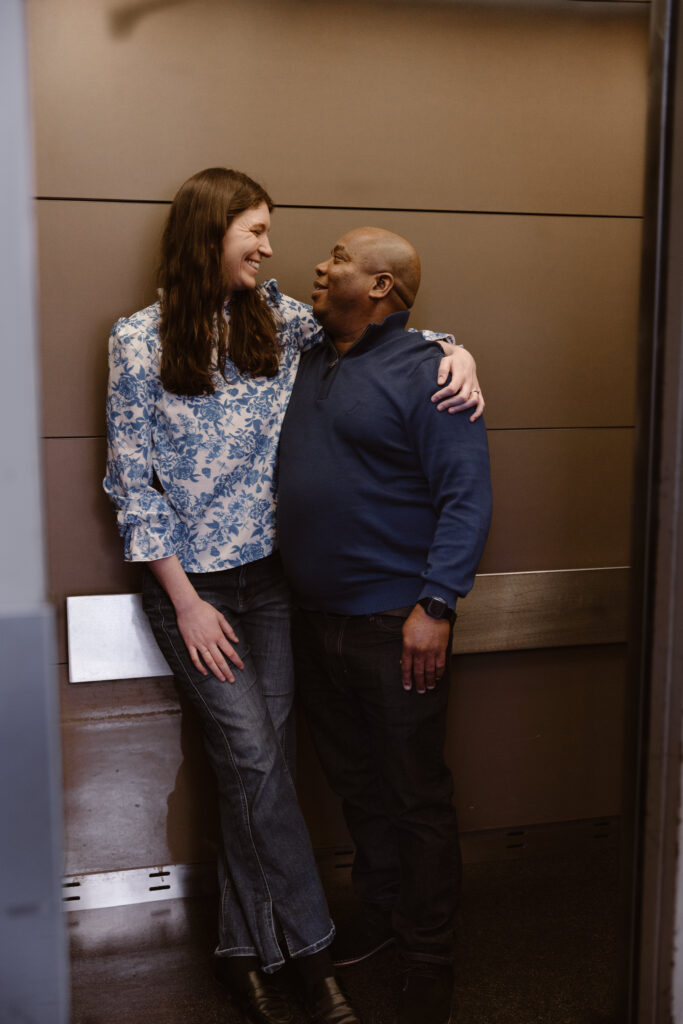 Couple looking at each other in an elevator