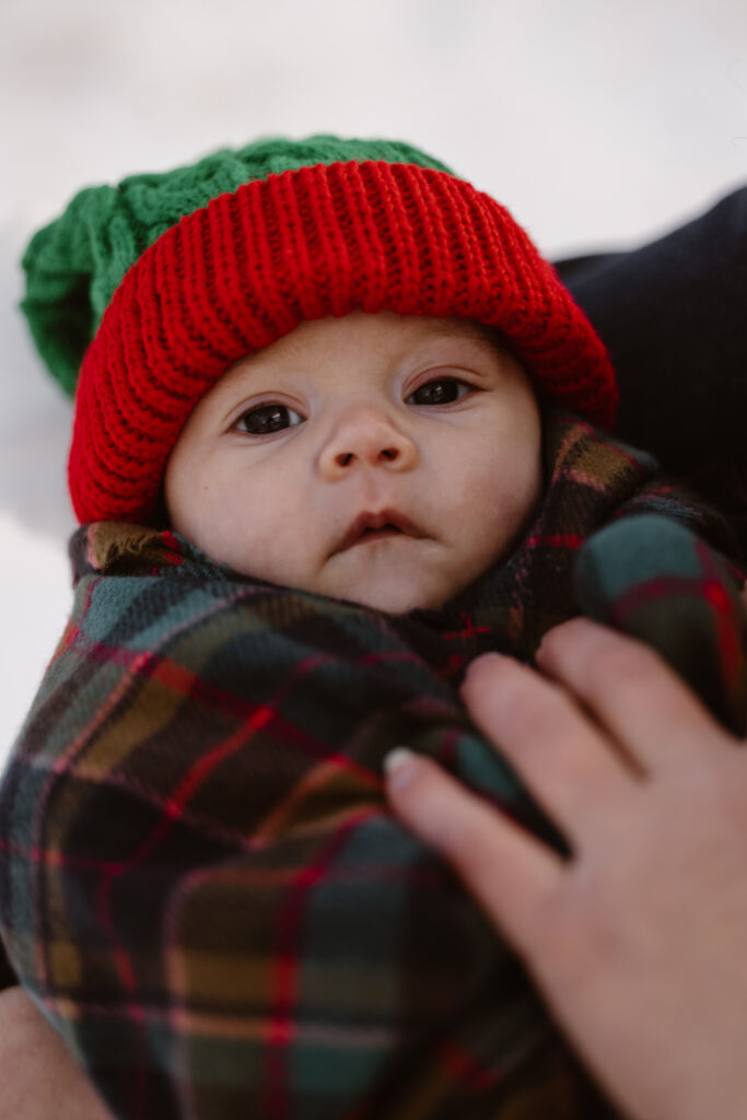 Newborn daughter portrait while mom is holding her