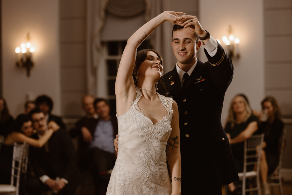 Groom spinning his bride during their first dance