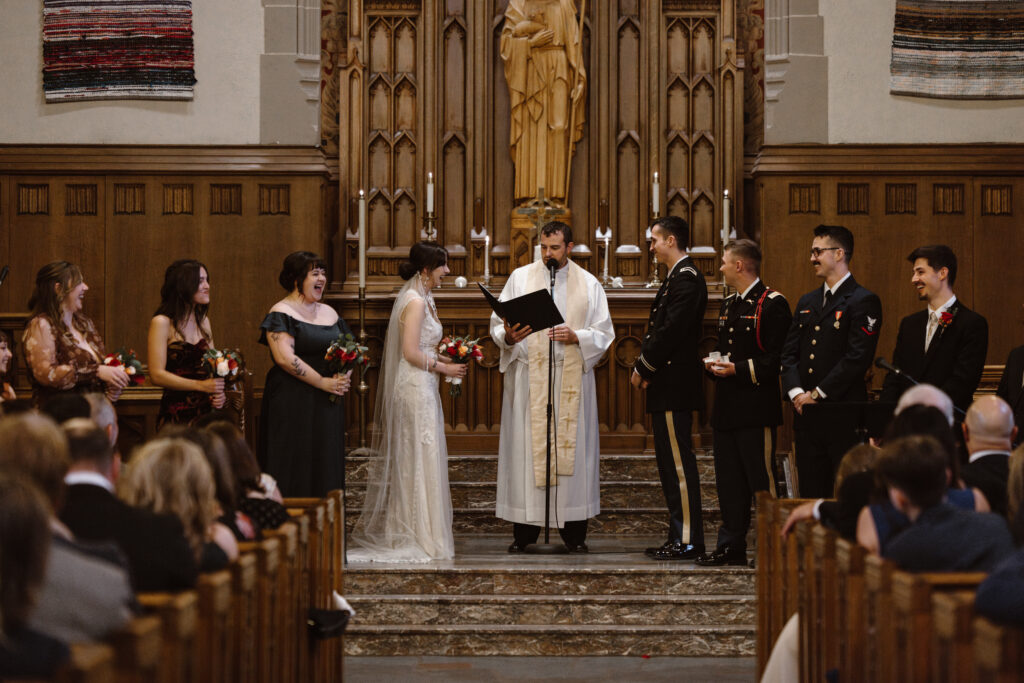Bride and groom smiling during their wedding ceremony in a church