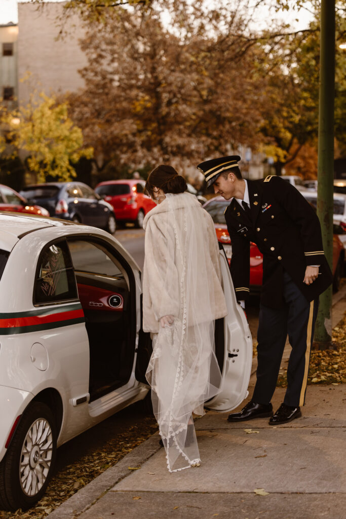 Groom opening car door for his bride