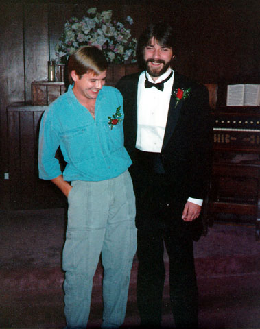 Groom standing with his best man during a Las Vegas elopement in the 1960s, both wearing boutonnieres inside a small chapel.